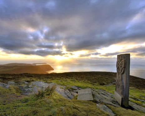 Ancient monument on clifftop at sunset