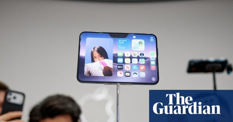 People taking pictures of the new iPhone Duo at its launch in California.