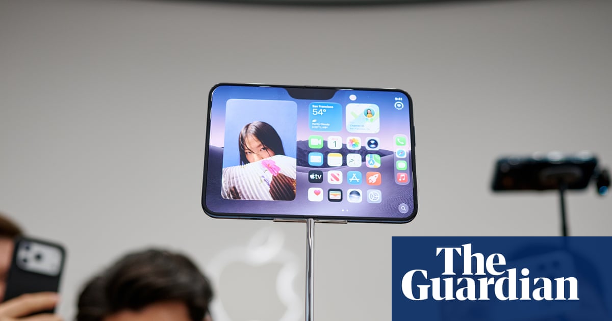 People taking pictures of the new iPhone Duo at its launch in California.